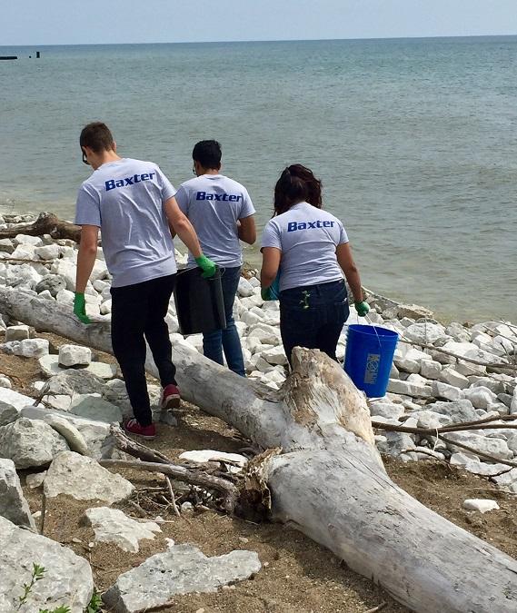 Baxter employees cleaning beach