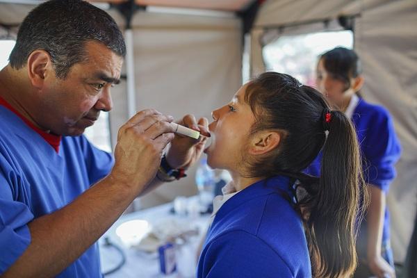 Doctor examining a young patient